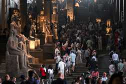 GIZA (Egypt), 04/11/2025.- Visitors walk among statues displayed at the Grand Staircase of the Grand Egyptian Museum (GEM) during the museum's opening to the public, in Giza, Egypt, 04 November 2025. Located on the Giza Plateau, the Grand Egyptian Museum is recognized as the world's largest archaeological museum dedicated to a single culture, and is home to more than 100,000 artifacts. (Egipto) EFE/EPA/MOHAMED HOSSAM
