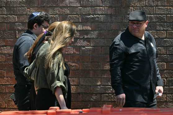 Valentyna (2nd L), mother of 10-year-old Matilda, who was killed in the December 14 Bondi Beach shooting attack, and Matilda's father (R) arrive for her funeral in Sydney on December 18, 2025. The attack at Bondi Beach on December 14 was one of the deadliest in Australian history. (Photo by Saeed KHAN / AFP)