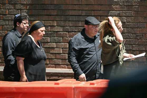 Valentyna (2nd L), mother of 10-year-old Matilda, who was killed in the December 14 Bondi Beach shooting attack, and Matilda's father (2nd R) arrive for her funeral in Sydney on December 18, 2025. The attack at Bondi Beach on December 14 was one of the deadliest in Australian history. (Photo by Saeed KHAN / AFP)