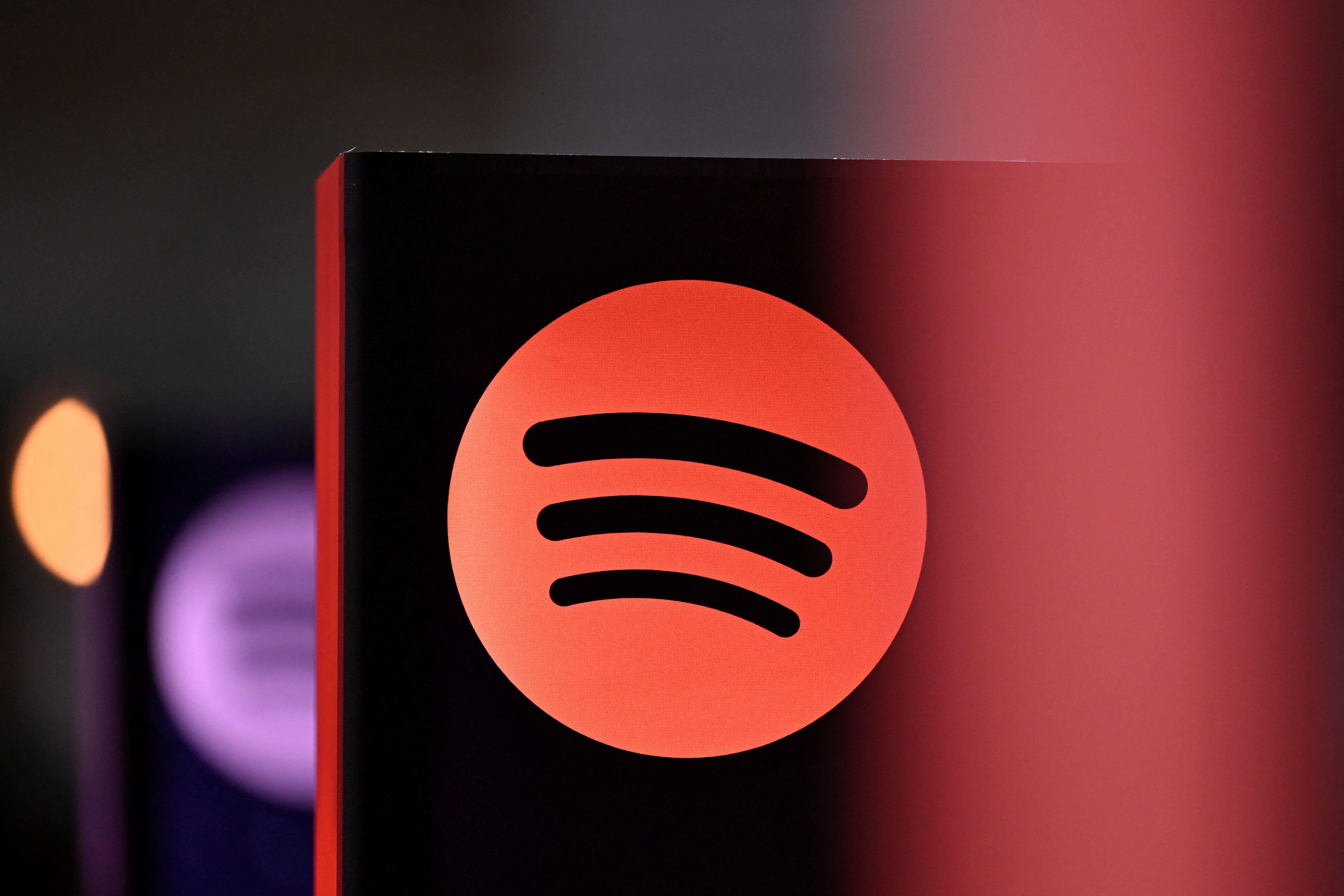 (FILES) A Spotify logo is pictured at the 77th Frankfurt book fair, the world's biggest trade fair for books, in Frankfurt am Main, western Germany on October 17, 2025. Music streaming service Spotify said on December 22, 2025 it had disabled accounts from a piracy activist hacker group that claimed to have "backed up" millions of Spotify's music files and metadata. The group Anna's Archives said in a blog post it had backed up 86 million Spotify tracks and the metadata for 256 million tracks -- a process known as "scraping" -- in order to start an open "preservation archive" for music. (Photo by Kirill KUDRYAVTSEV / AFP)