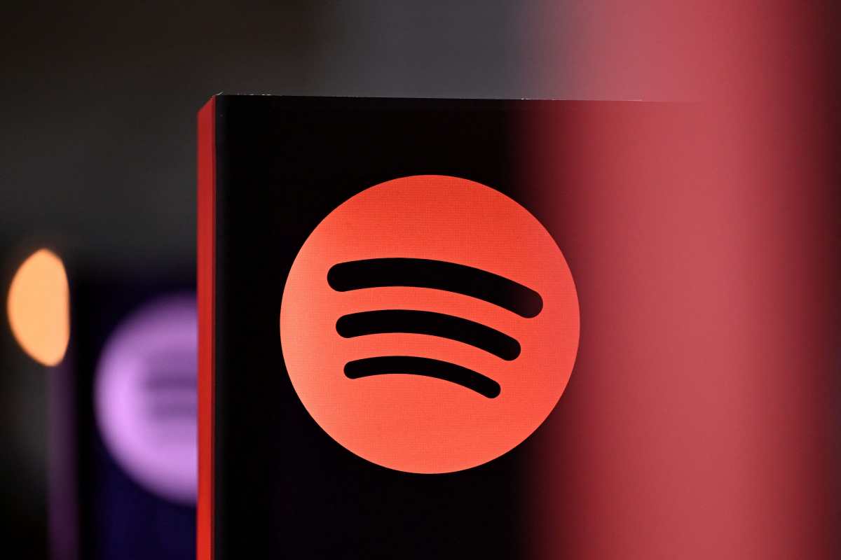 (FILES) A Spotify logo is pictured at the 77th Frankfurt book fair, the world's biggest trade fair for books, in Frankfurt am Main, western Germany on October 17, 2025. Music streaming service Spotify said on December 22, 2025 it had disabled accounts from a piracy activist hacker group that claimed to have "backed up" millions of Spotify's music files and metadata. The group Anna's Archives said in a blog post it had backed up 86 million Spotify tracks and the metadata for 256 million tracks -- a process known as "scraping" -- in order to start an open "preservation archive" for music. (Photo by Kirill KUDRYAVTSEV / AFP)