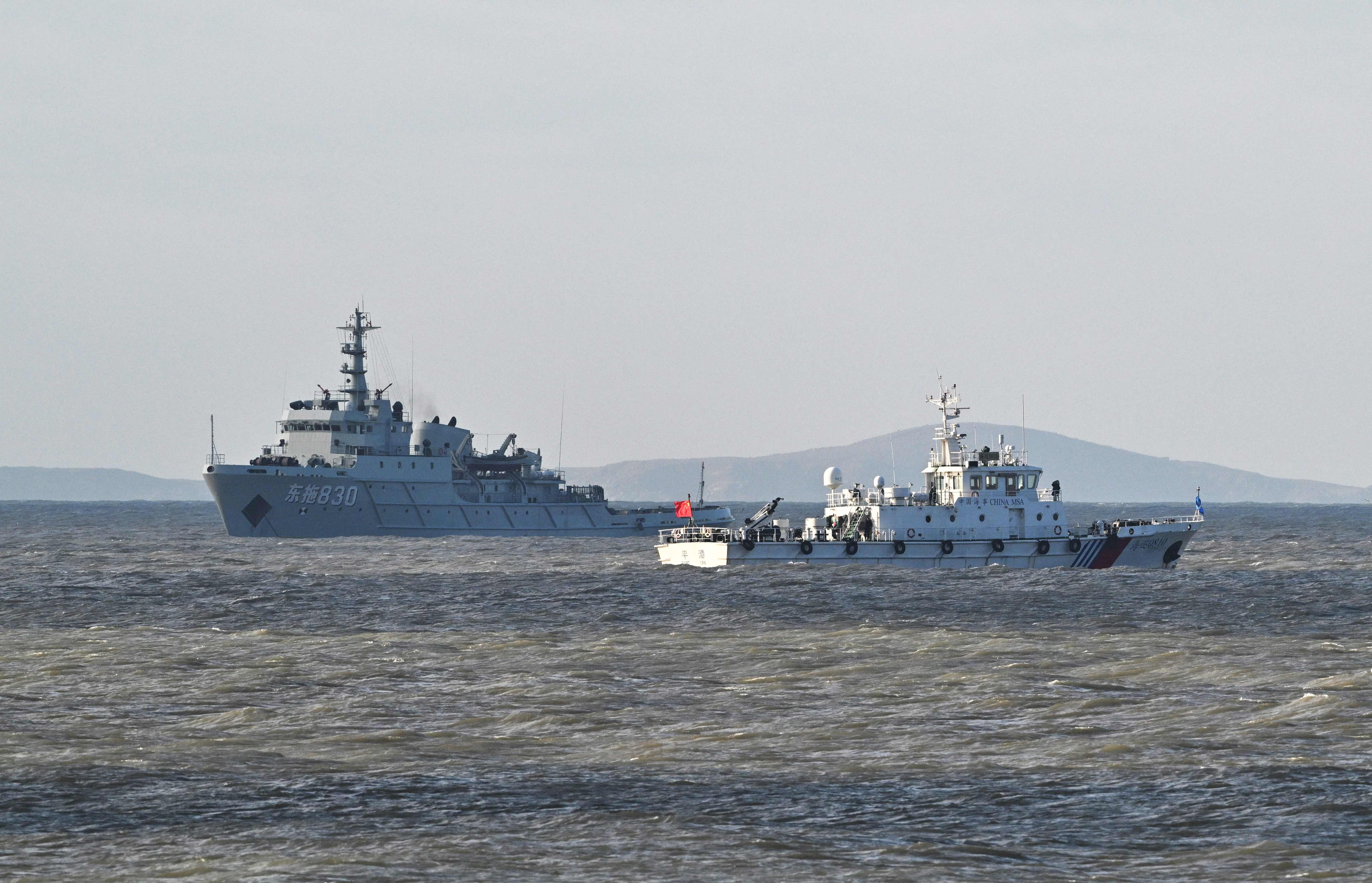 Chinese ships patrol as the Peoples Liberation Army (PLA) conduct military drills on Pingtan island, in eastern Chinas Fujian province, the closest point to Taiwan, on December 30, 2025. Taiwan said Tuesday it had detected 130 Chinese military aircraft near the island in a 24-hour period, as China began a second day of live-fire drills. (Photo by ADEK BERRY / AFP)