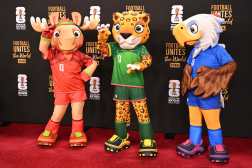 The FIFA World Cup 2026 mascots (L-R), Maple the Moose (Canada), Zayu the Jaguar (Mexico), and Clutch the Bald Eagle (US) pose on the red carpet upon arrival to attend the draw for the 2026 FIFA Football World Cup taking place in the US, Canada and Mexico, at the Kennedy Center, in Washington, DC, on December 5, 2025. (Photo by Roberto SCHMIDT / AFP)