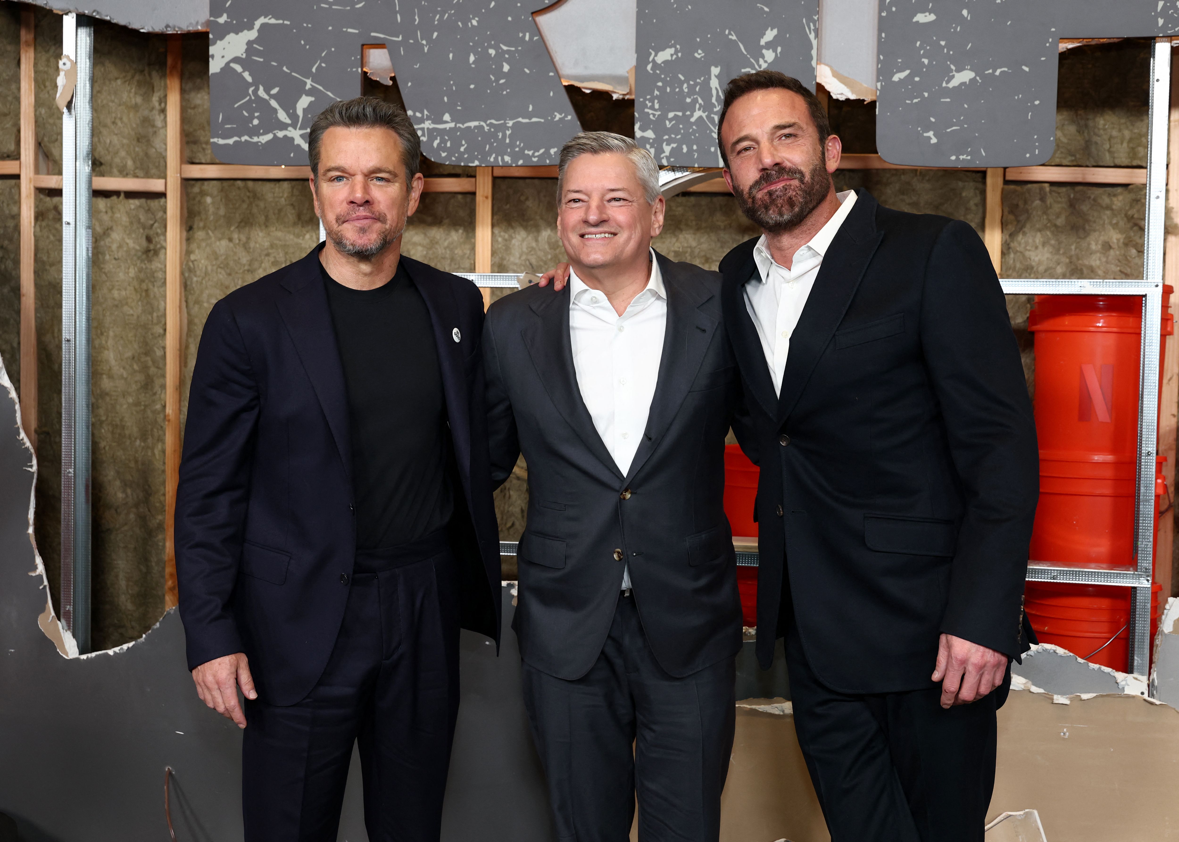 NEW YORK, NEW YORK - JANUARY 13: (L-R) Matt Damon, Ted Sarandos and Ben Affleck attend Netflix's "The Rip" New York Premiere at Alice Tully Hall, Lincoln Center on January 13, 2026 in New York City.   Cindy Ord/Getty Images/AFP (Photo by Cindy Ord / GETTY IMAGES NORTH AMERICA / Getty Images via AFP)
