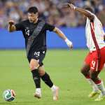 LOS ANGELES, CALIFORNIA - JANUARY 17: Darwin Lom #14 of Guatemala controls the ball against Kamal Miller #4 of Canada in the first half of an International Friendly at BMO Stadium on January 17, 2026 in Los Angeles, California. Ronald Martinez/Getty Images/AFP (Photo by RONALD MARTINEZ / GETTY IMAGES NORTH AMERICA / Getty Images via AFP)