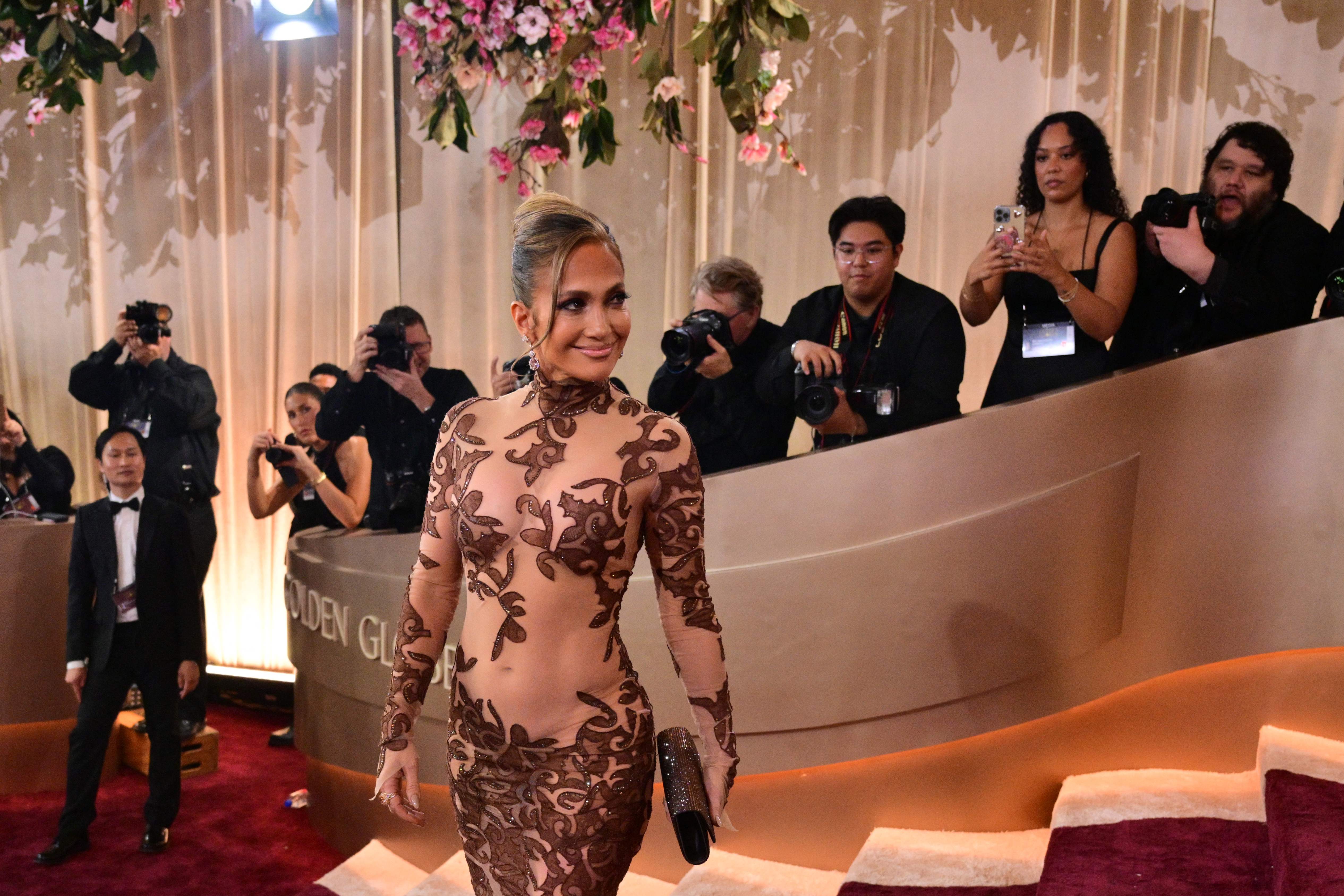 Jennifer López (JLo) habla de su admiración por Madonna en medio del lanzamiento de Office Romance, su nueva comedia romántica para Netflix.  (Foto Prensa Libre:  Hemeroteca PL/AFP)