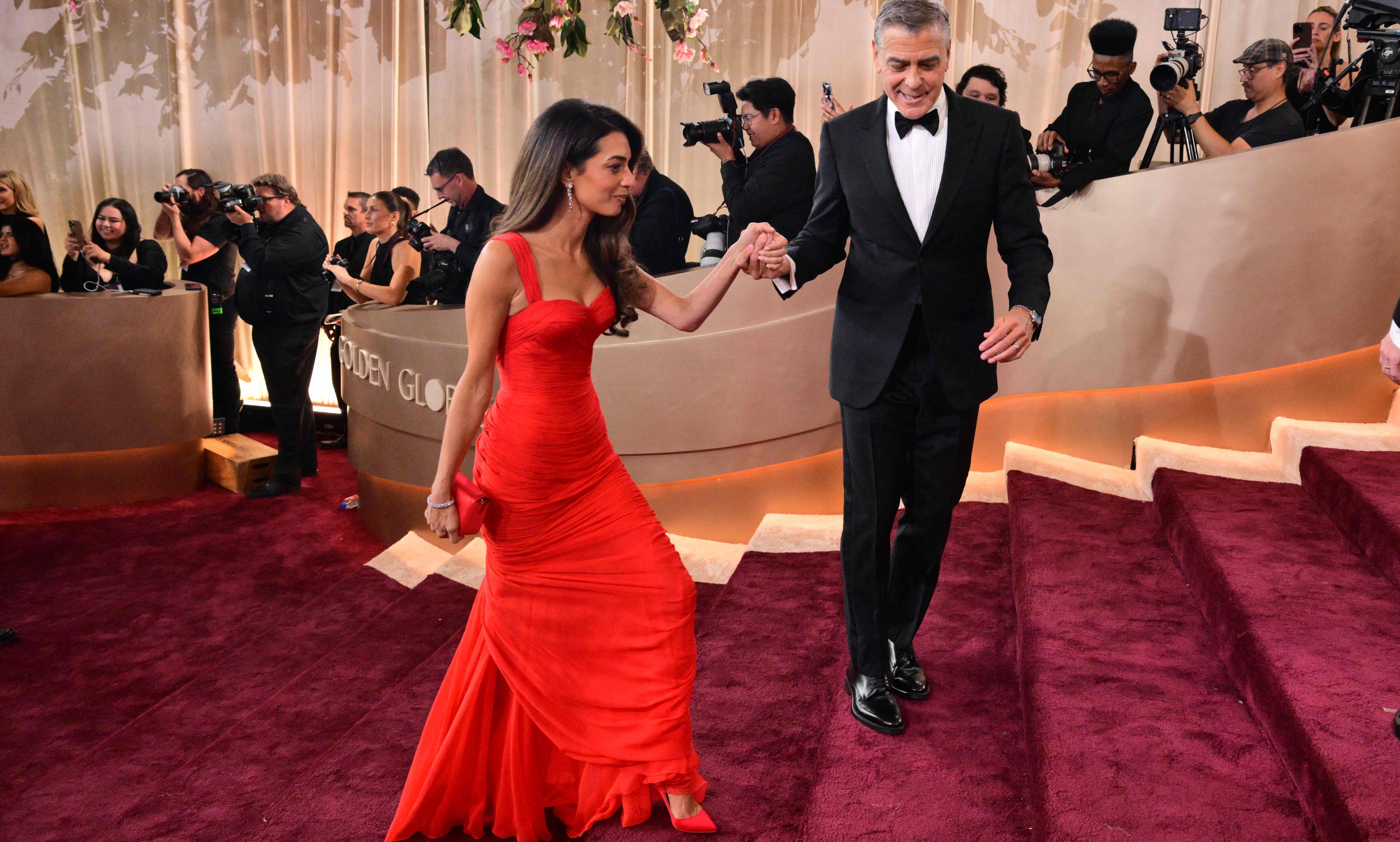 US actor George Clooney and wife Amal Clooney attend the 83rd annual Golden Globe Awards at the Beverly Hilton hotel in Beverly Hills, California, on January 11, 2026. (Photo by Frederic J. Brown / AFP) / -- IMAGE RESTRICTED TO EDITORIAL USE - STRICTLY NO COMMERCIAL USE --