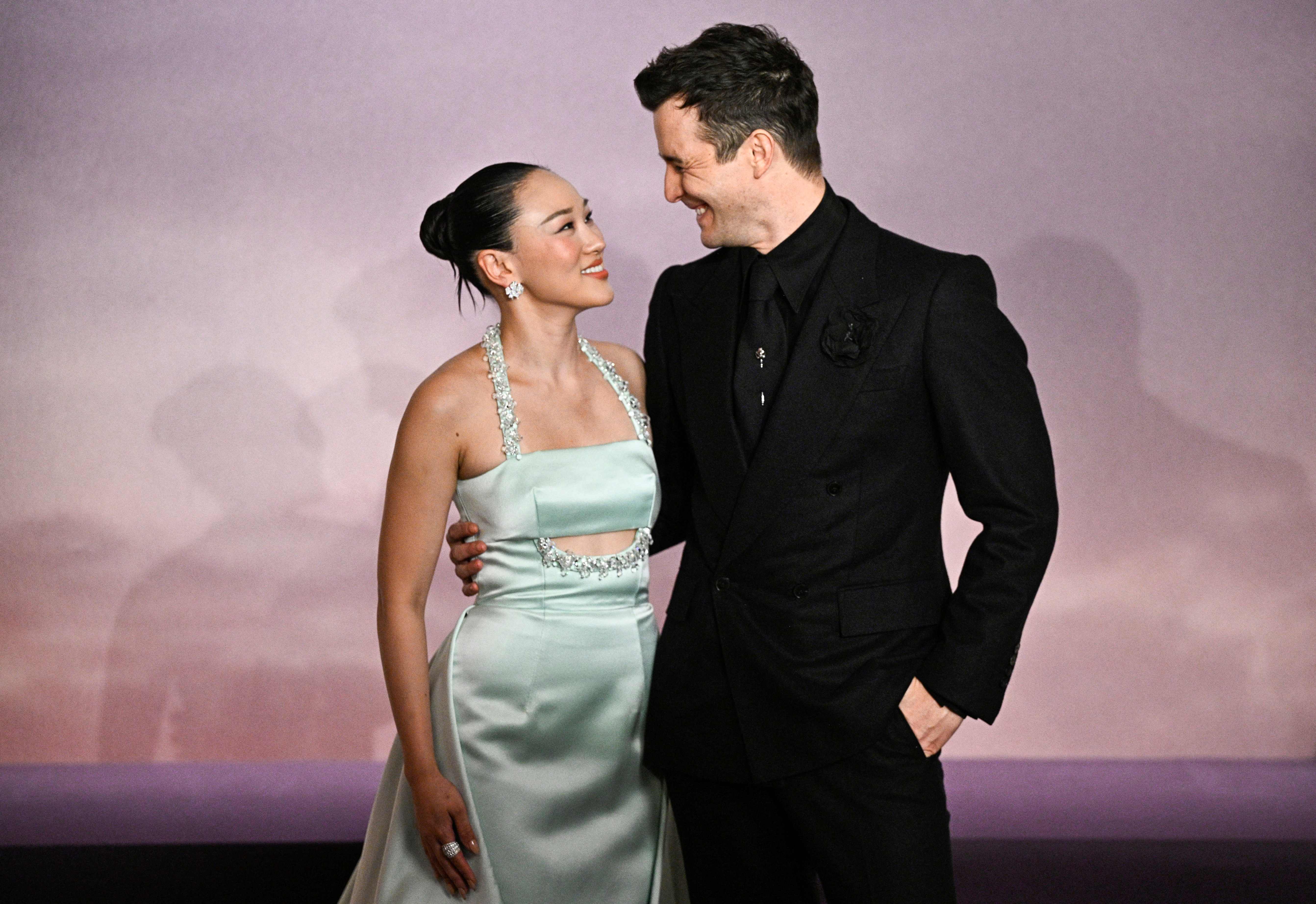Australian actress Yerin Ha and British actor Luke Thompson arrive for the World premiere of "Bridgerton Season 4" at the Palais Brongniart in Paris on January 14, 2026. (Photo by JULIEN DE ROSA / AFP)
