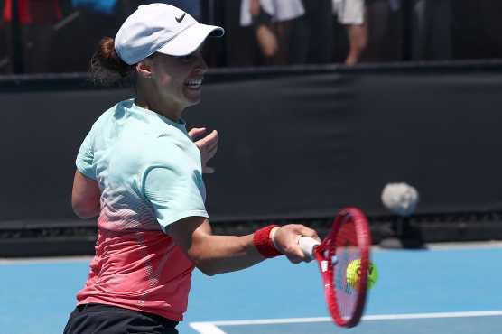 Ukraine's Anhelina Kalinina hits a return to China's Wang Xinyu during their women's singles match on day three of the Australian Open tennis tournament in Melbourne on January 20, 2026. (Photo by Izhar Khan / AFP) / -- IMAGE RESTRICTED TO EDITORIAL USE - STRICTLY NO COMMERCIAL USE --