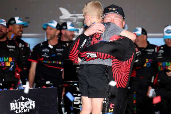 DAYTONA BEACH, FLORIDA - FEBRUARY 15: Tyler Reddick, driver of the #45 Chumba Casino Toyota, and son, Beau Reddick celebrate in victory lane after winning the NASCAR Cup Series Daytona 500 at Daytona International Speedway on February 15, 2026 in Daytona Beach, Florida. Chris Graythen/Getty Images/AFP (Photo by Chris Graythen / GETTY IMAGES NORTH AMERICA / Getty Images via AFP)
