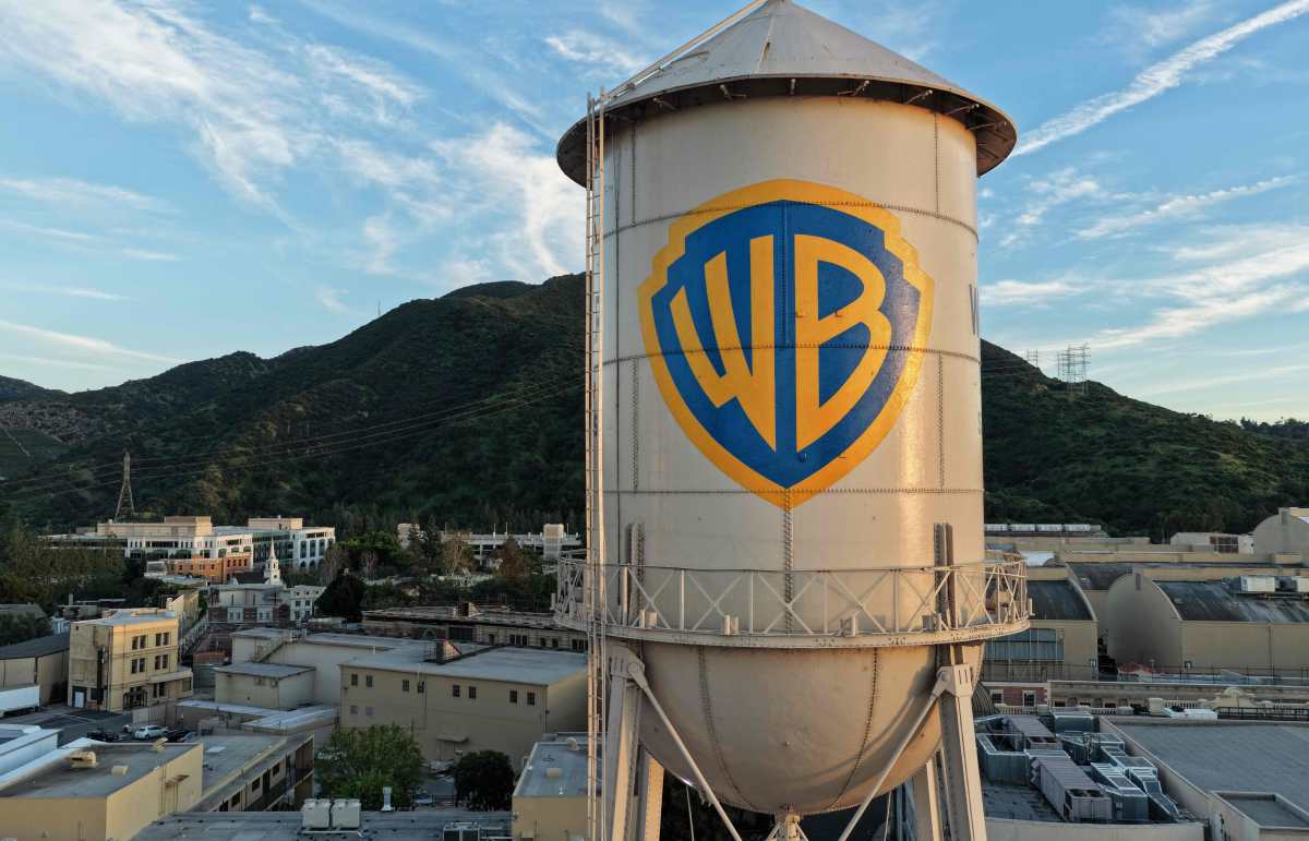 BURBANK, CALIFORNIA - FEBRUARY 27: In an aerial view, the Warner Bros. logo is displayed on the water tower at Warner Bros. Studio on February 27, 2026 in Burbank, California. Warner Bros. Discovery has agreed to be acquired by Paramount Skydance in a deal reportedly worth $110 billion.   Mario Tama/Getty Images/AFP (Photo by MARIO TAMA / GETTY IMAGES NORTH AMERICA / Getty Images via AFP)