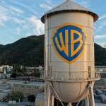 BURBANK, CALIFORNIA - FEBRUARY 27: In an aerial view, the Warner Bros. logo is displayed on the water tower at Warner Bros. Studio on February 27, 2026 in Burbank, California. Warner Bros. Discovery has agreed to be acquired by Paramount Skydance in a deal reportedly worth $110 billion. Mario Tama/Getty Images/AFP (Photo by MARIO TAMA / GETTY IMAGES NORTH AMERICA / Getty Images via AFP)