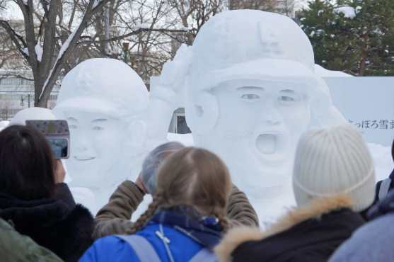 Snow sculptures depicting Japanese baseball player Shohei Ohtani (R), who plays with the Los Angeles Dodgers in US Major League Baseball, and others are displayed at the Sapporo Snow Festival which opened in Sapporo, Hokkaido Prefecture on February 4, 2026. (Photo by JIJI Press / AFP) / Japan OUT