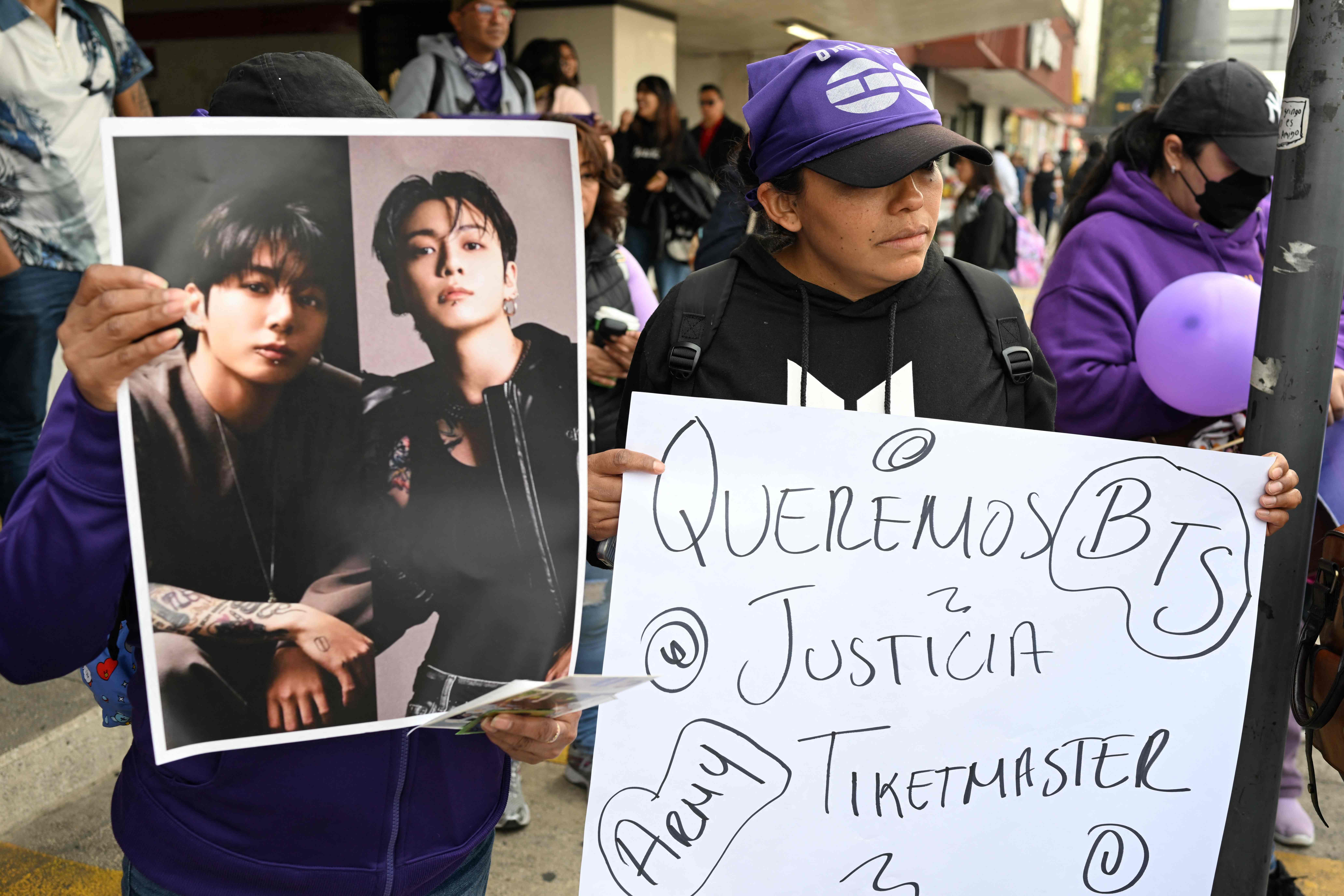 Fans of South Korean band BTS take part in a protest against the mass cancellation and invalidation of tickets for the group's concert in Mexico City on February 6, 2026. (Photo by Yuri CORTEZ / AFP)