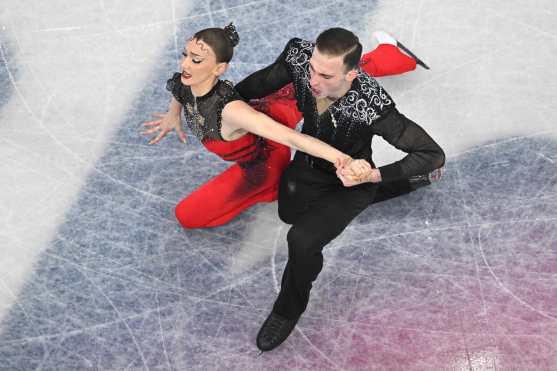 CORRECTION / Georgia's Anastasiia Metelkina and Georgia's Luka Berulava compete in the figure skating pair skating short program during the Milano Cortina 2026 Winter Olympic Games at Milano Ice Skating Arena in Milan on February 15, 2026. (Photo by Antonin THUILLIER / AFP) / The erroneous mention[s] appearing in the metadata of this photo by Antonin THUILLIER                    has been modified in AFP systems in the following manner: [Georgia's Anastasiia Metelkina] instead of [Georgia's Anastasiia Gubanova]. Please immediately remove the erroneous mention[s] from all your online services and delete it (them) from your servers. If you have been authorized by AFP to distribute it (them) to third parties, please ensure that the same actions are carried out by them. Failure to promptly comply with these instructions will entail liability on your part for any continued or post notification usage. Therefore we thank you very much for all your attention and prompt action. We are sorry for the inconvenience this notification may cause and remain at your disposal for any further information you may require.