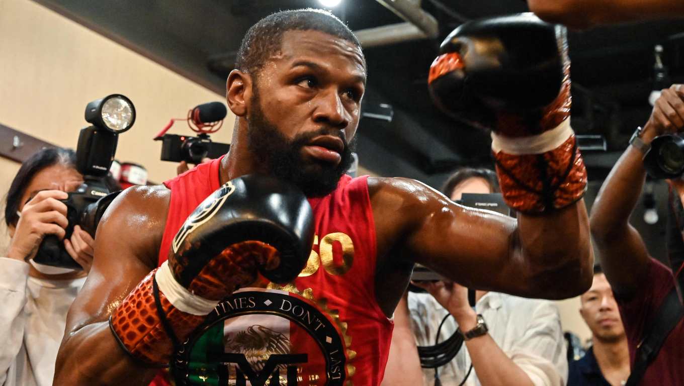 (FILES) US boxer great Floyd Mayweather takes part in a training session at a gym in Tokyo on September 22, 2022, ahead of his planned exhibition boxing match against Japanese mixed martial artist Mikuru Asakura on September 25. Floyd Mayweather is coming out of retirement and will return to professional boxing after his exhibition fight with Mike Tyson this spring, he announced on February 20. Former multi-weight world champion Mayweather retired from boxing in 2017, unbeaten in 50 bouts, though he has appeared in several exhibition fights since. (Photo by Richard A. Brooks / AFP)
