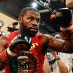 (FILES) US boxer great Floyd Mayweather takes part in a training session at a gym in Tokyo on September 22, 2022, ahead of his planned exhibition boxing match against Japanese mixed martial artist Mikuru Asakura on September 25. Floyd Mayweather is coming out of retirement and will return to professional boxing after his exhibition fight with Mike Tyson this spring, he announced on February 20. Former multi-weight world champion Mayweather retired from boxing in 2017, unbeaten in 50 bouts, though he has appeared in several exhibition fights since. (Photo by Richard A. Brooks / AFP)