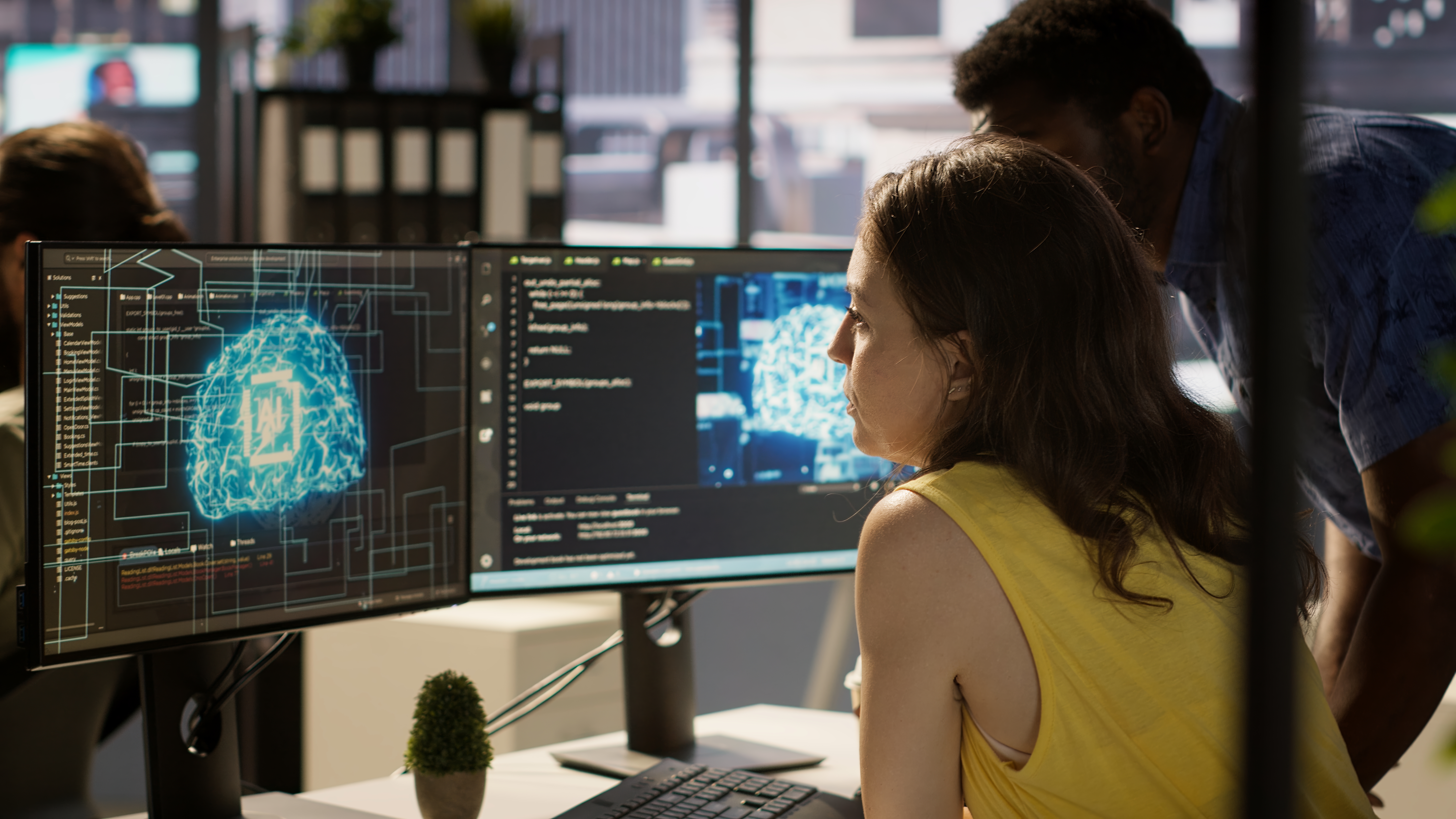 Employee using AI technology to design algorithms that enable machines to learn from data. Admin in office training large scale deep learning models with artificial intelligence tech, camera A