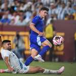Argentina's forward #09 Julian Alvarez (R) takes a shot on goal as Guatemala's defender #04 Jose Carlos Pinto looks on during the international friendly football match between Guatemala and Argentina at Commanders Field in Greater Landover, Maryland, on June 14, 2024. (Photo by Andrew Caballero-Reynolds / AFP)