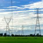 high voltage electric pole,High voltage power pole on blue sky background