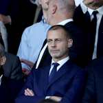 PARIS (France), 08/04/2026.- (from left) Former French President Nicolas Sarkozy, UEFA President Aleksander Ceferin and PSG President Nasser Al-Khelaifi wait for the start of the UEFA Champions League quarter-finals, 1st leg match between Paris Saint-Germain FC and Liverpool FC in Paris, France, 08 April 2026. (Liga de Campeones, Francia) EFE/EPA/CHRISTOPHE PETIT TESSON