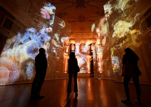 MILAN (Italy), 20/04/2026.- Visitors look at 'Anima Mundi', a site-specific installation by multidisciplinary design studio Dotdotdot for Geely Auto, presented as part of the Fuori Salone Design Week exhibition in Milan, Italy, 20 April 2026. The Salone Internazionale del Mobile and Fuori Salone will run from 21 to 26 April 2026. (Italia) EFE/EPA/DANIEL DAL ZENNARO