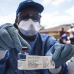 MBANDAKA (Congo Rep. of), 30/04/2026.- (FILE) - A worker from the World Health Organization (WHO) holds up a vaccination as he prepares to administer it during the launch of an experimental Ebola vaccine in Mbandaka, north-western Democratic Republic of the Congo, 21 May 2018 (reissued 30 April 2026). WHO's World Immunisation Week is celebrated during the last week of April to raise awareness of the importance of vaccines. This year, the focus is not only on childhood vaccines but also on immunisation throughout life, with an emphasis on adult vaccines, protection against ageing, and preventive care. EFE/EPA/STR