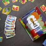 LAUSANNE (Switzerland), 12/05/2026.- A young collector opens a book before sticking Panini World Cup stickers of the Switzerland's soccer national team in the official Panini album of the FIFA World Cup 2026, in Lausanne, Switzerland, 12 May 2026. (Mundial de Fútbol, Suiza) EFE/EPA/LAURENT GILLIERON
