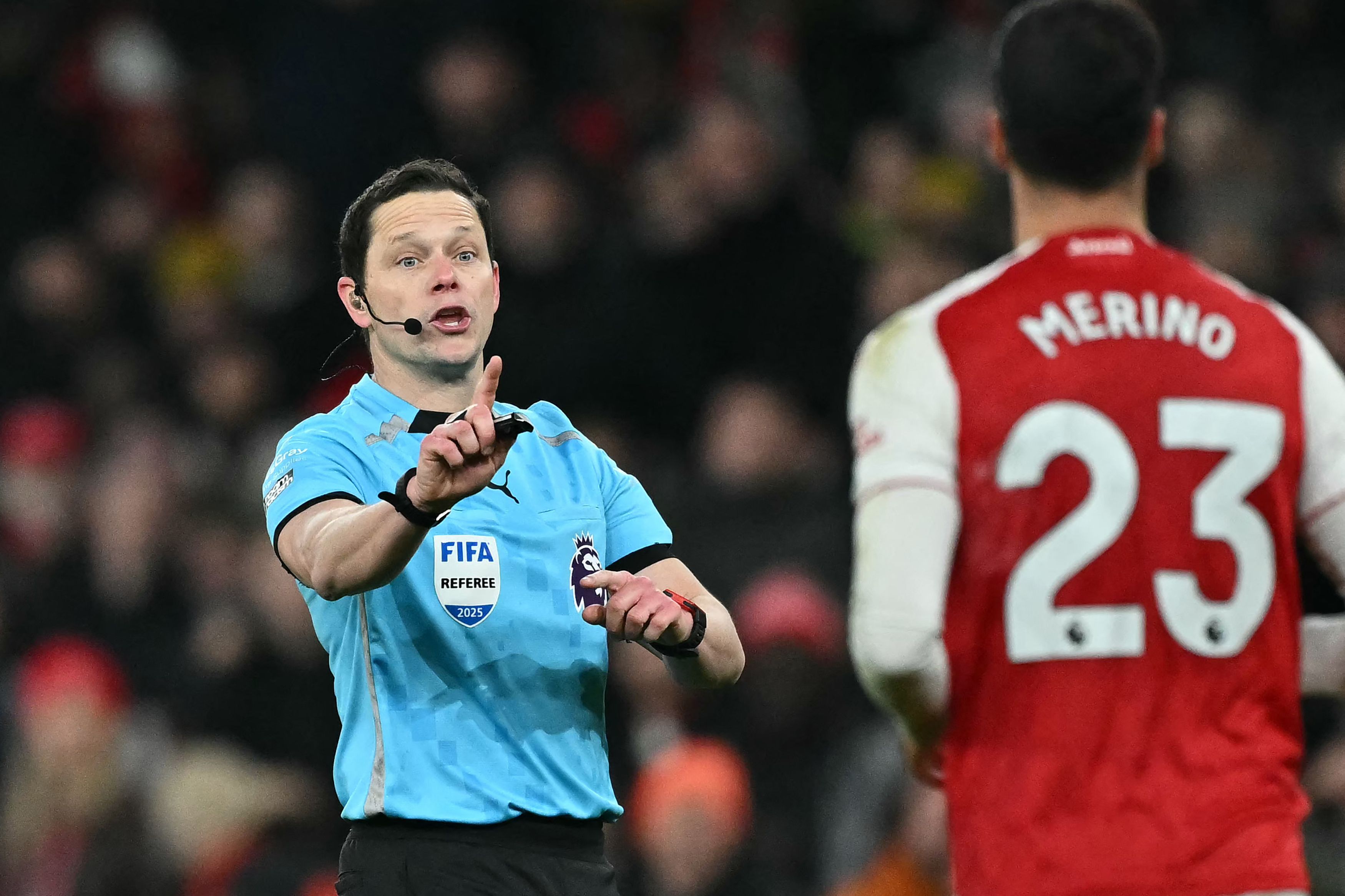 English referee Darren England gestures during the English Premier League football match between Arsenal and Aston Villa at the Emirates Stadium in London on December 30, 2025. (Photo by Ben STANSALL / AFP) / RESTRICTED TO EDITORIAL USE. No use with unauthorized audio, video, data, fixture lists, club/league logos or 'live' services. Online in-match use limited to 120 images. An additional 40 images may be used in extra time. No video emulation. Social media in-match use limited to 120 images. An additional 40 images may be used in extra time. No use in betting publications, games or single club/league/player publications. /