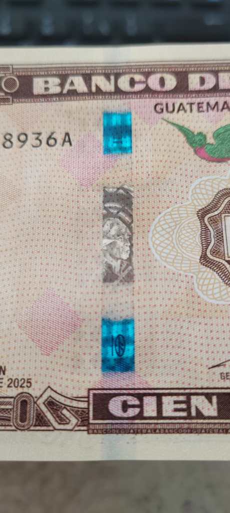 Security thread of the Q100 Commemorative Bill. 