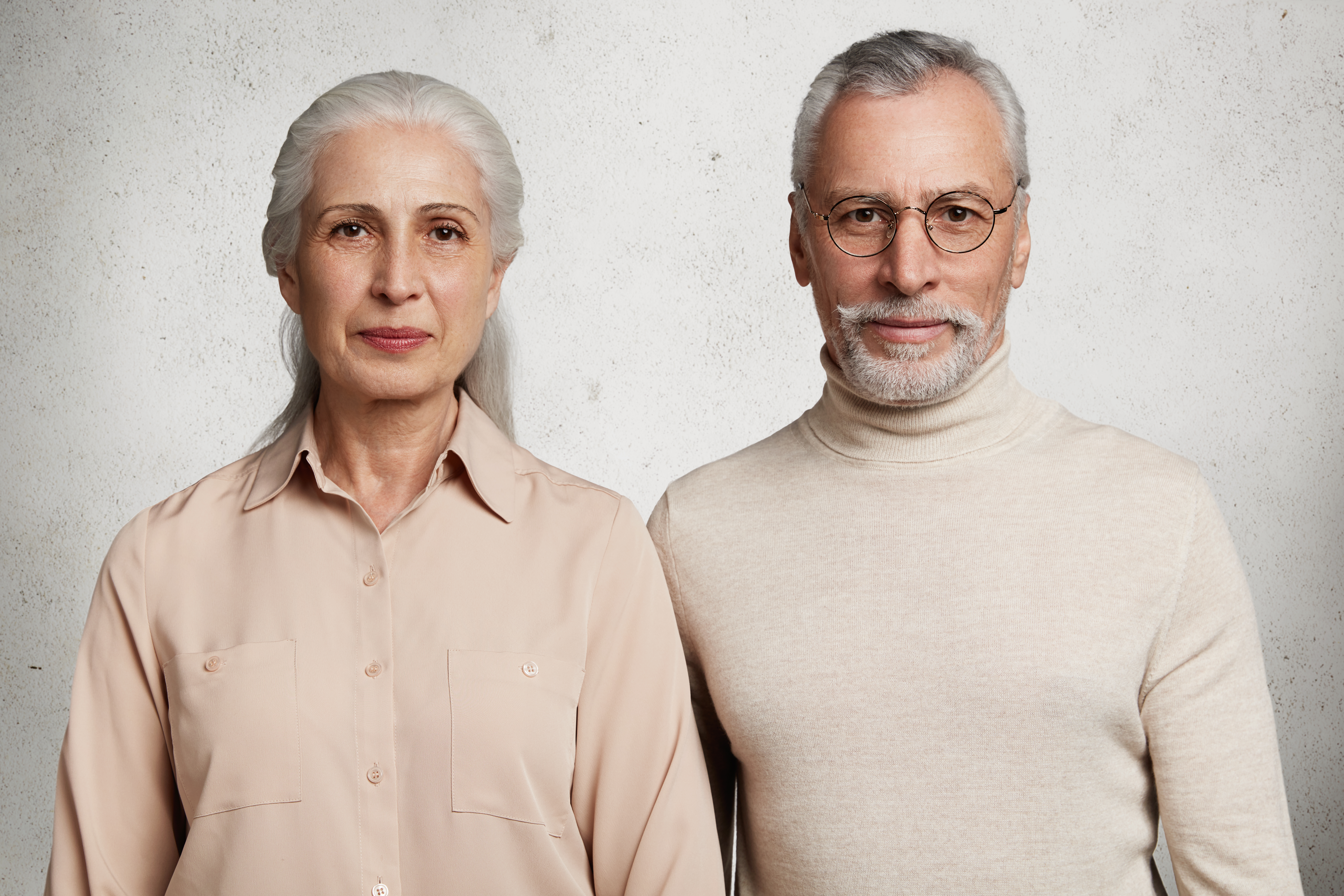 Mature couple in love stand close to each other being happy to recieve congratulations from relatives, celebrate anniversary of wedding, being together for long time, have good relationships