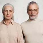 Mature couple in love stand close to each other being happy to recieve congratulations from relatives, celebrate anniversary of wedding, being together for long time, have good relationships