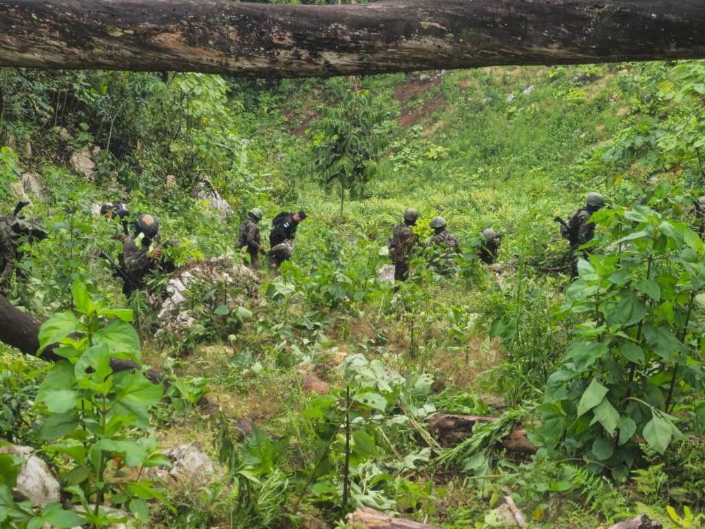 Guatemalan Army soldiers patrol a jungle area of Petén during anti-drug operations.