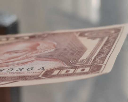 Latent image in the lower right part of the Q100 Commemorative Bill 
