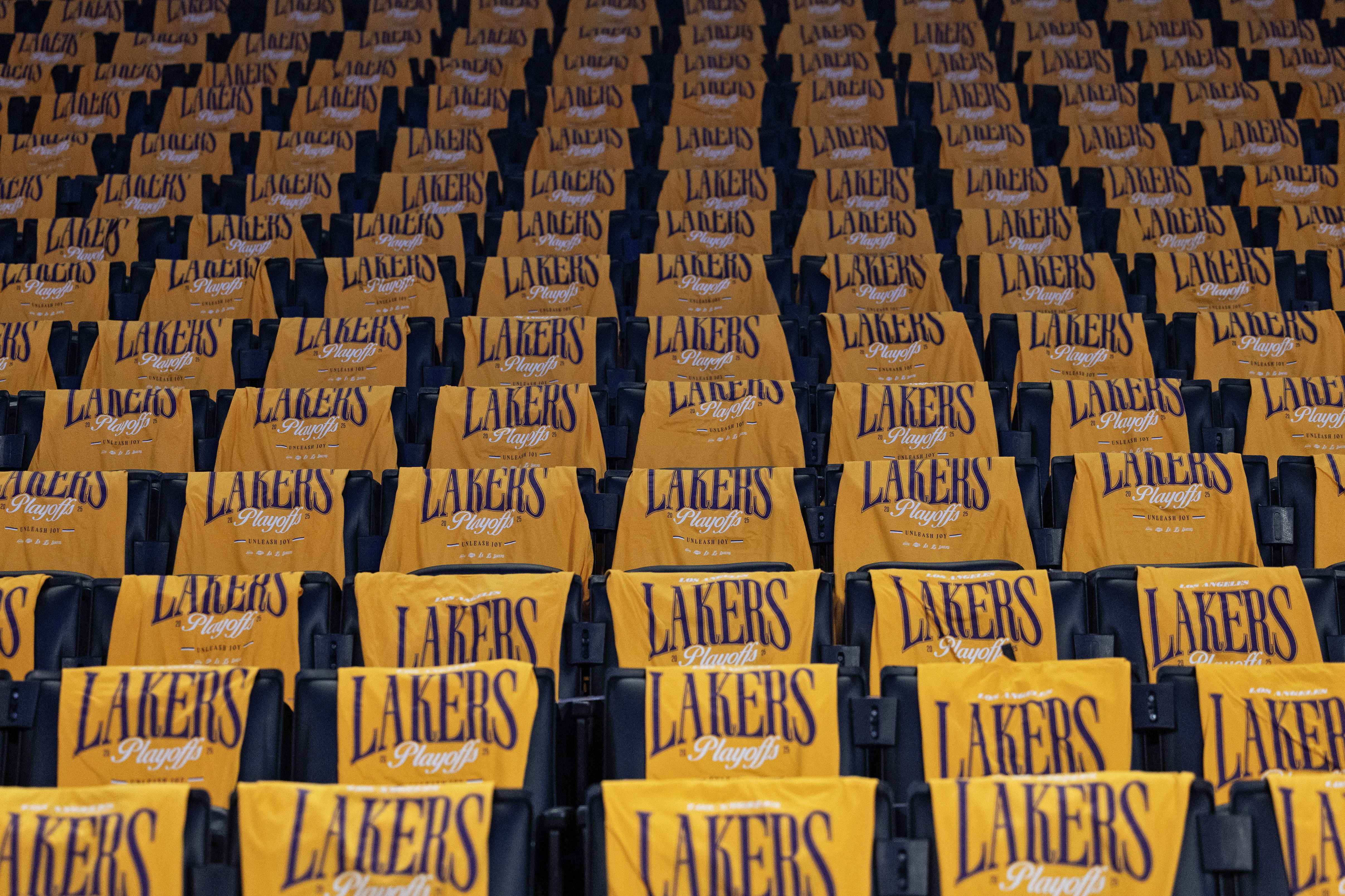 Los Angeles (United States), 12/08/2026.- (FILE) - T-shirts are laid out on the back of the seats before the start of the NBA playoffs round one game one between the Minnesota Timberwolves and the Los Angeles Lakers in Los Angeles, California, 19 April 2025 (re-issued 12 August 2026). The LA Lakers are to be sold to former Disney CEO Bob Iger and venture capitalist Josh Kushner, both confirmed in a joint statement on 12 August 2026. The record-breaking 12.5 billion US dollar deal is pending the NBA Board of Governor's approval. (Baloncesto) EFE/EPA/ALLISON DINNER SHUTTERSTOCK OUT