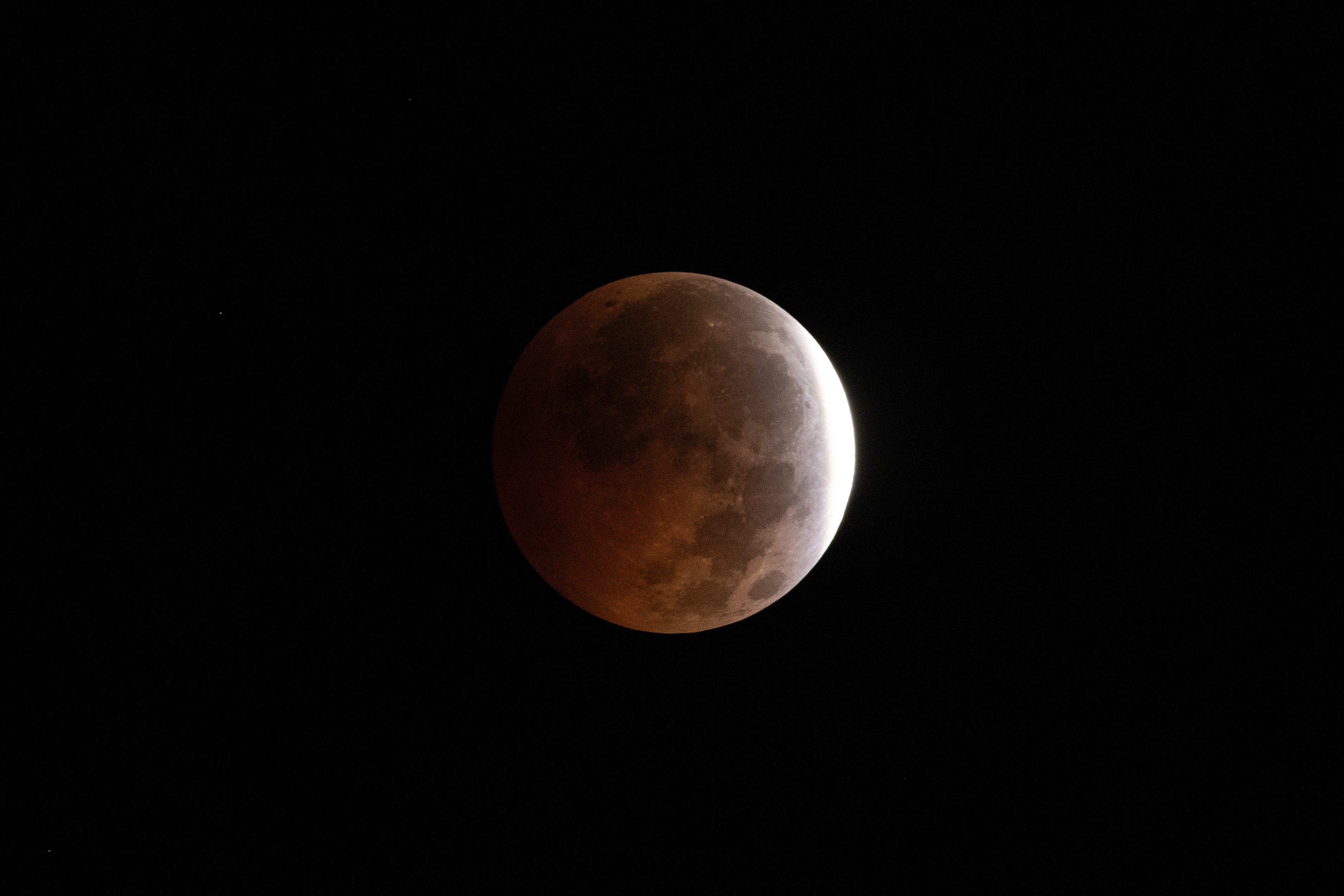 DAKAR (Senegal), 28/08/2026.- A partial lunar eclipse is seen over Dakar, Senegal, 28 August 2026. During a partial lunar eclipse, the Earth's shadow covers parts of the Moon. EFE/EPA/JEROME FAVRE