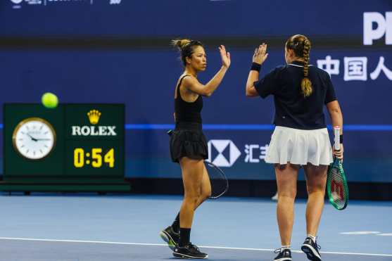 BEIJING (China), 09/10/2026.- Hsieh Su-wei (L) of Taiwan and Jelena Ostapenko (R) of Latvia celebrate during their Womens Doubles match against Erin Routliffe of New Zealand and Aldila Sutjiadi of Indonesia at the China Open tennis tournament in Beijing, China, 09 October 2026. China Open runs from 28 September through 11 October. (Tenis, Letonia, Nueva Zelanda) EFE/EPA/WU HAO