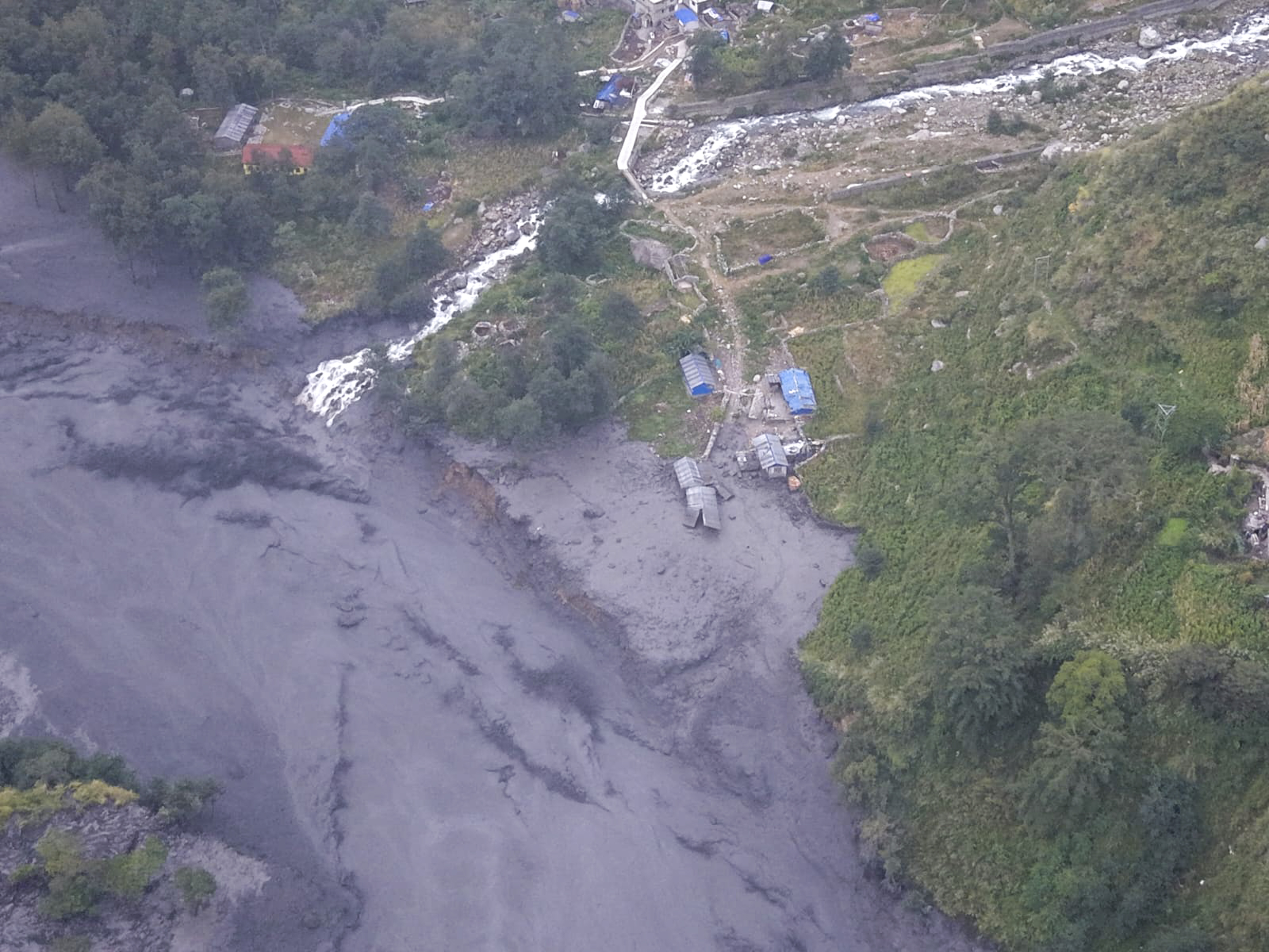 Gorkha (Nepal), 11/10/2026.- A handout photo made available by the National Trust for Nature Conservation-Manaslu Conservation Area Project (NTNC-MCAP) shows an aerial view of the Budhi Gandaki River swollen by flash floods in Gorkha district, Nepal, 11 October 2026. A debris-laden flash flood has swept away more than a dozen houses and bridges, according to the National Disaster Risk Reduction and Management Authority (NDRRMA). (Inundaciones) EFE/EPA/NTNC-MCAP/HANDOUT HANDOUT EDITORIAL USE ONLY/NO SALES