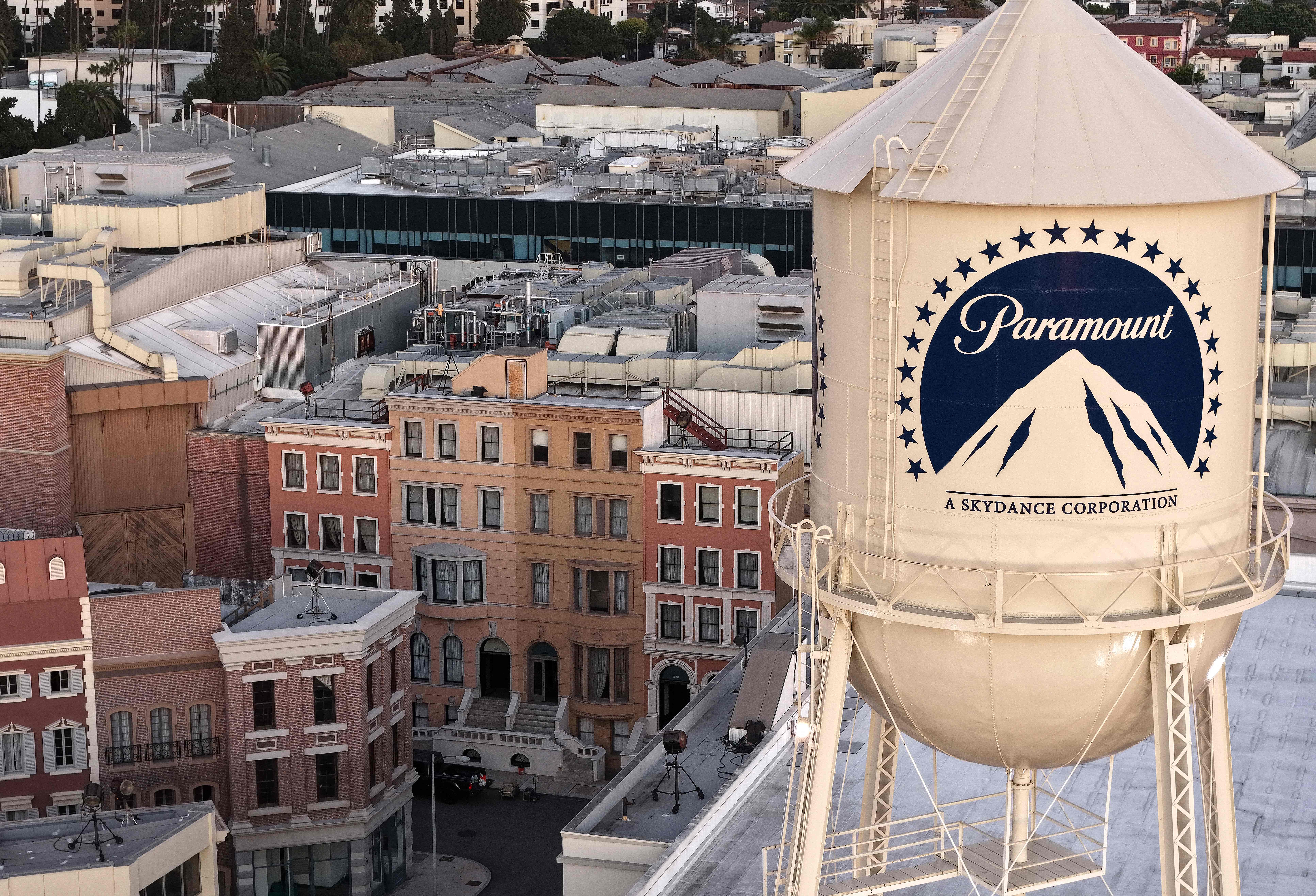 LOS ANGELES, CALIFORNIA - DECEMBER 08: An aerial view of the Paramount logo displayed on the water tower at Paramount Studios on December 8, 2025 in Los Angeles, California. Entertainment giant Paramount, now renamed Paramount Skydance, is attempting a hostile takeover bid for Warner Bros. Discovery worth $108.4 billion.   Mario Tama/Getty Images/AFP (Photo by MARIO TAMA / GETTY IMAGES NORTH AMERICA / Getty Images via AFP)